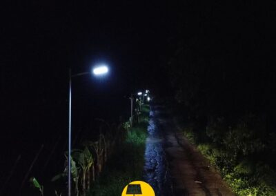 A row of solar-powered streetlights installed by Mount Solar Power Lucena brightens a rural road in Quezon at night. Mount Solar Power Quezon ensures safe, energy-efficient lighting for remote communities in Lucena and Quezon.